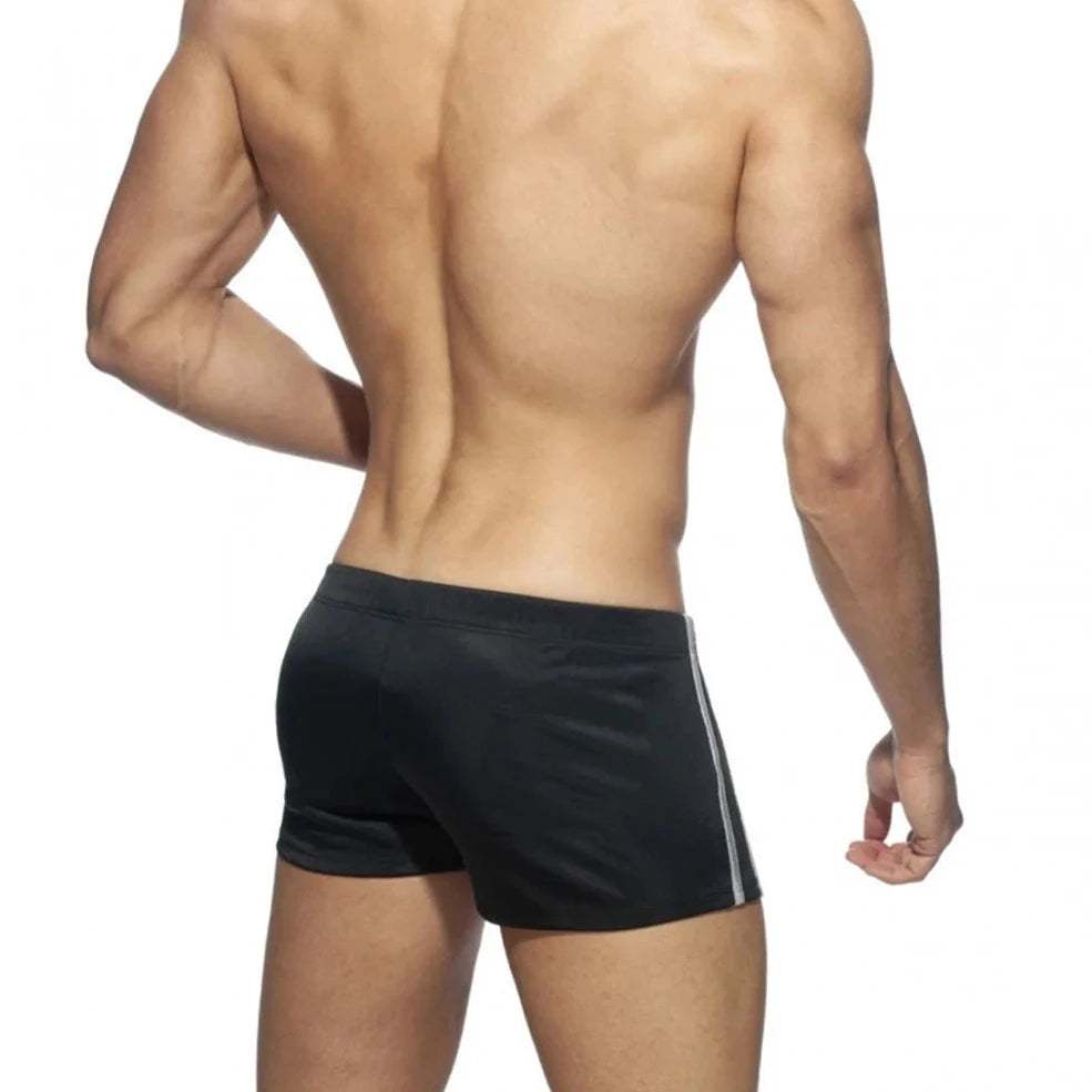 a hot gay man in black Bowtie Side Double Striped Swim Trunks - pridevoyageshop.com - gay men’s underwear and swimwear