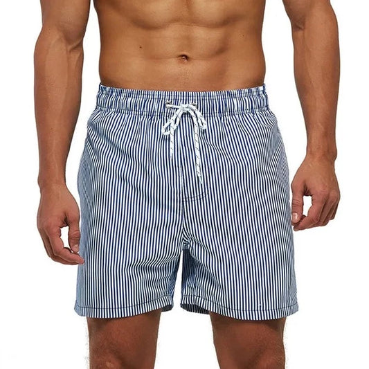 a hot gay man in Blue Vertical Phased Board Shorts - pridevoyageshop.com - gay men’s underwear and swimwear