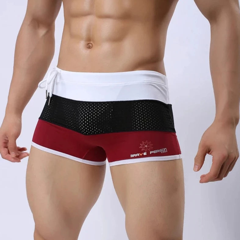a hot gay man in Red + Black + White Men's Tricolor Mesh Swim Trunks - pridevoyageshop.com - gay men’s underwear and swimwear