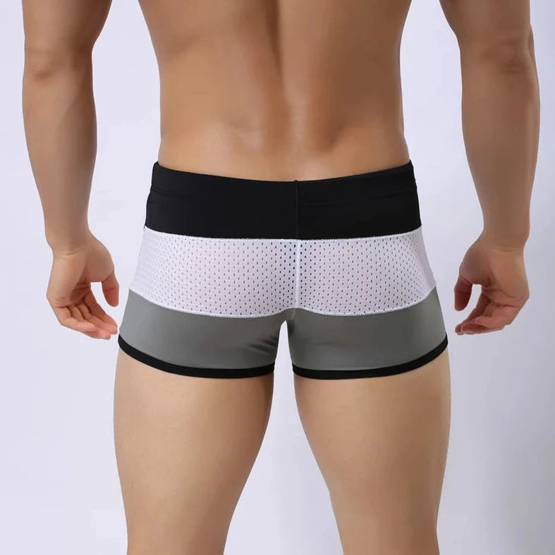 a hot gay man in Grey + White + Black Men's Tricolor Mesh Swim Trunks - pridevoyageshop.com - gay men’s underwear and swimwear