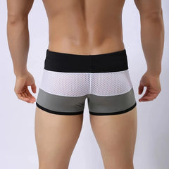 a hot gay man in Grey + White + Black Men's Tricolor Mesh Swim Trunks - pridevoyageshop.com - gay men’s underwear and swimwear