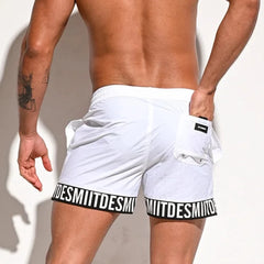 a hot man in white Desmiit Scripted Tide Board Shorts - pridevoyageshop.com - gay men’s underwear and swimwear