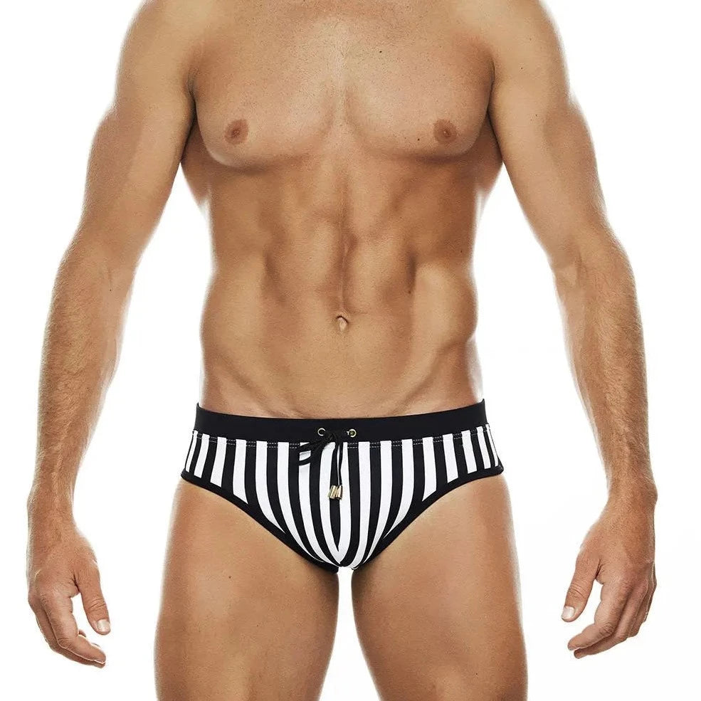 a sexy gay man in Wild Zebra's Stripes Swim Briefs - pridevoyageshop.com - gay men’s underwear and swimwear