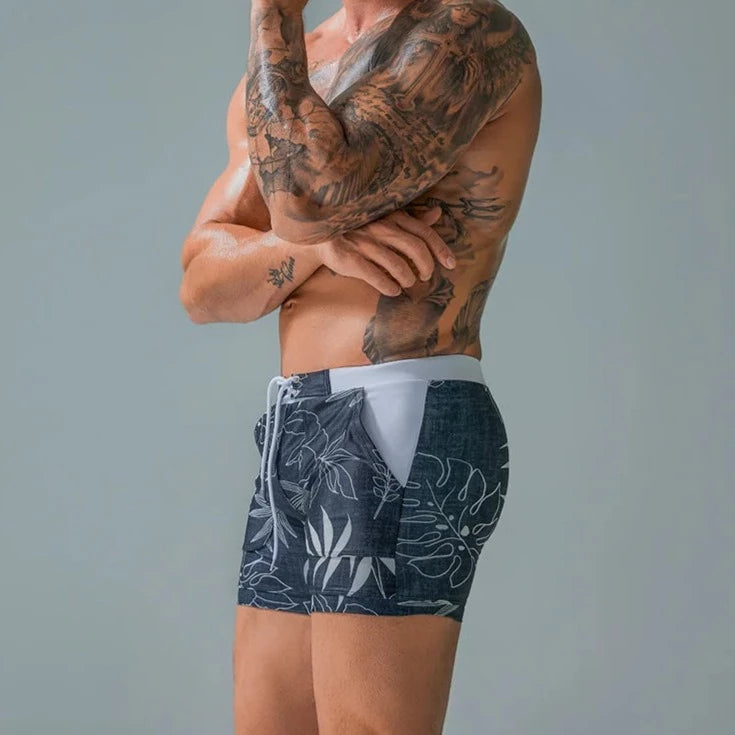 a hot gay man in blue Wild Island Flirt Swim Trunks - pridevoyageshop.com - gay men’s underwear and swimwear