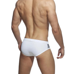a sexy gay man in white Monochrome Matrix Swim Briefs - pridevoyageshop.com - gay men’s underwear and swimwear