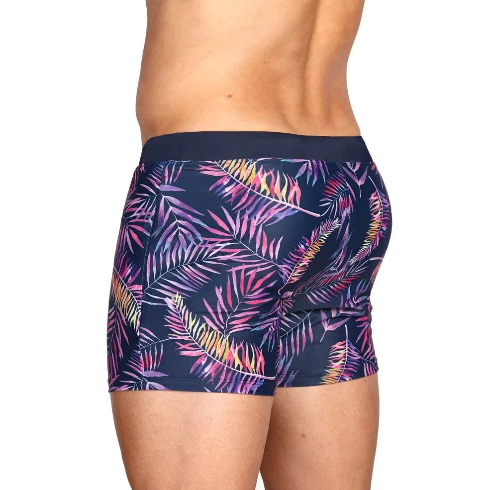 a hot gay man in Neon Palms Swim Trunks - pridevoyageshop.com - gay men’s underwear and swimwear