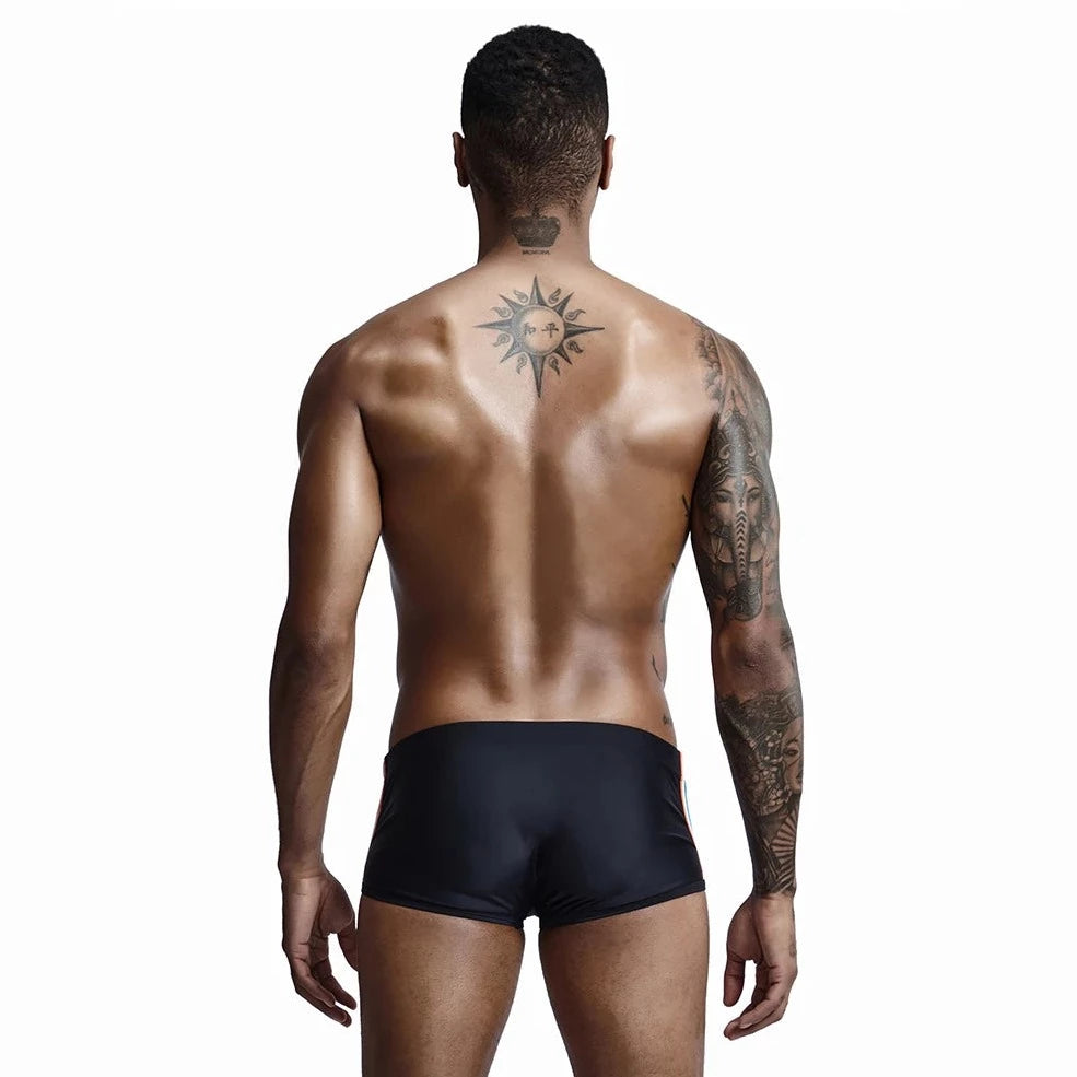 a hot gay man in black Bold Stripe Swim Trunks - pridevoyageshop.com - gay men’s underwear and swimwear