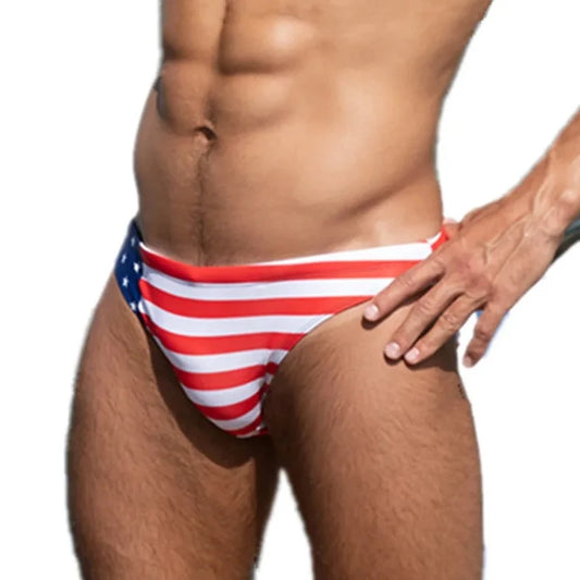 a hot gay man in US National Flags Skinny Swim Briefs - pridevoyageshop.com - gay men’s underwear and swimwear