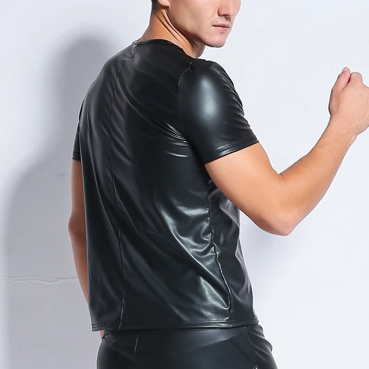 Praetorian Mesh and Faux Leather Tee in black worn by a muscular gay man posing to show the sheer mesh chest panels and faux-leather structure pridevoyageshopcom gay mens club tops fashion tops mesh tops