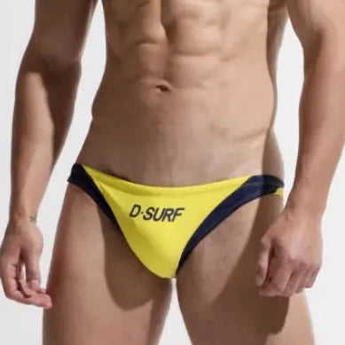 a sexy gay man in yellow DESMIIT Men's D-Surf Swim Briefs - pridevoyageshop.com - gay men’s underwear and swimwear