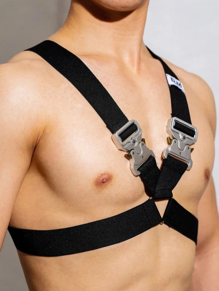 a sexy gay man in black DM Bound Buckle Chest Harness -pridevoyageshop.com - gay men’s harness, lingerie and fetish wear