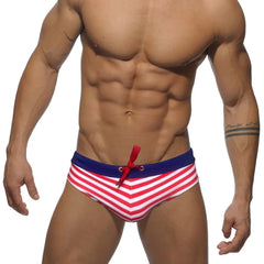 a hot gay man in red Sailor‘s Striped Bowtie Swim Briefs - pridevoyageshop.com - gay men’s underwear and swimwear