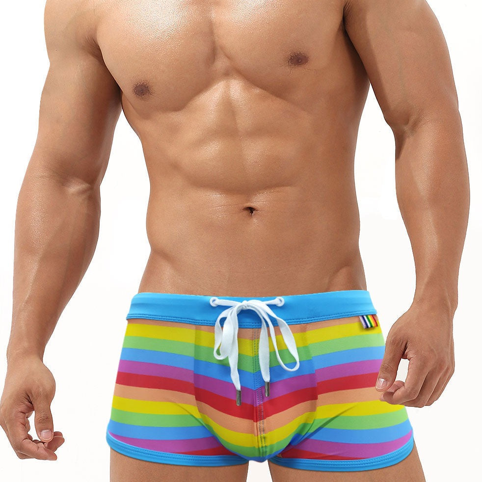 hot gay man in Gay Swimwear | Gay Men's Rainbow Drawstring Swim Trunks - pridevoyageshop.com - gay men’s underwear and swimwear