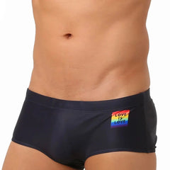 a hot gay in black Love Is Love Pride Swim Trunks - pridevoyageshop.com - gay men’s underwear and swimwear