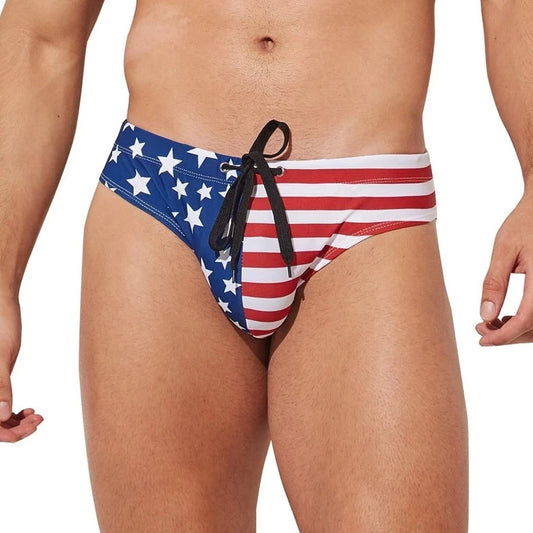 a sexy gay man in Men's Patriotic American Flag Swim Briefs - pridevoyageshop.com - gay men’s underwear and swimwear