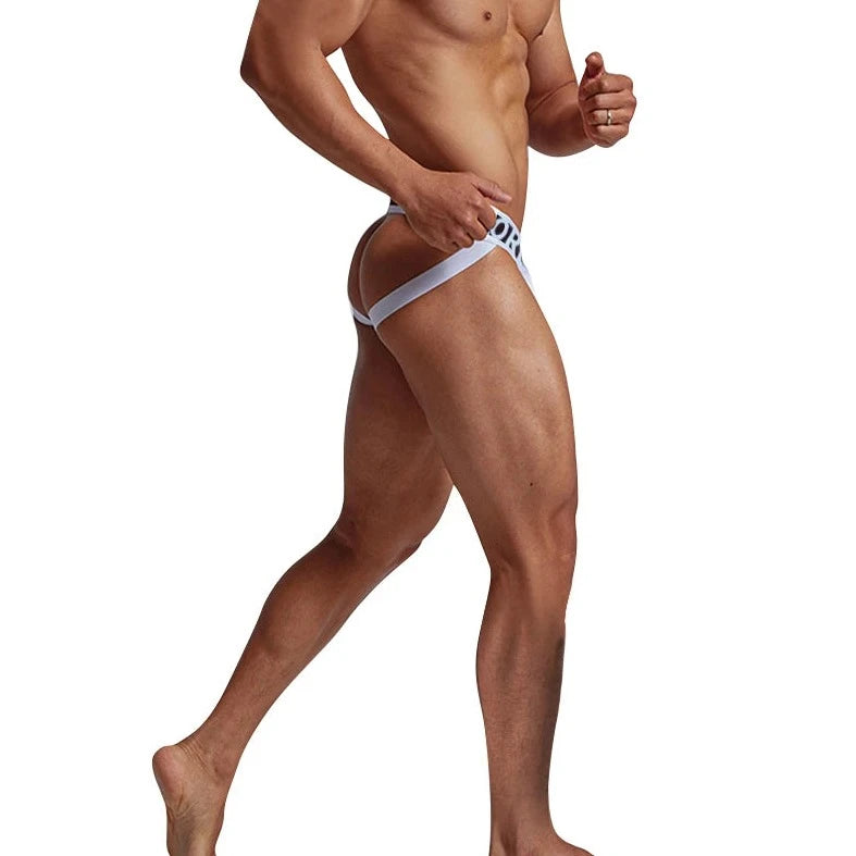 a hot gay man in white ORLVS Bold Jockstrap - pridevoyageshop.com - gay men’s underwear and swimwear