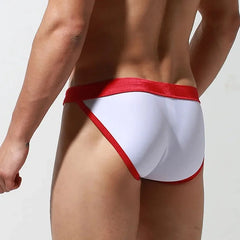 a sexy gay man in white Desmiit Bowtie High Leg Swim Briefs - pridevoyageshop.com - gay men’s underwear and swimwear