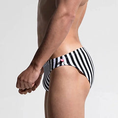 a hot gay man in Desmiit Vertical Striped Swim Briefs - pridevoyageshop.com - gay men’s underwear and swimwear