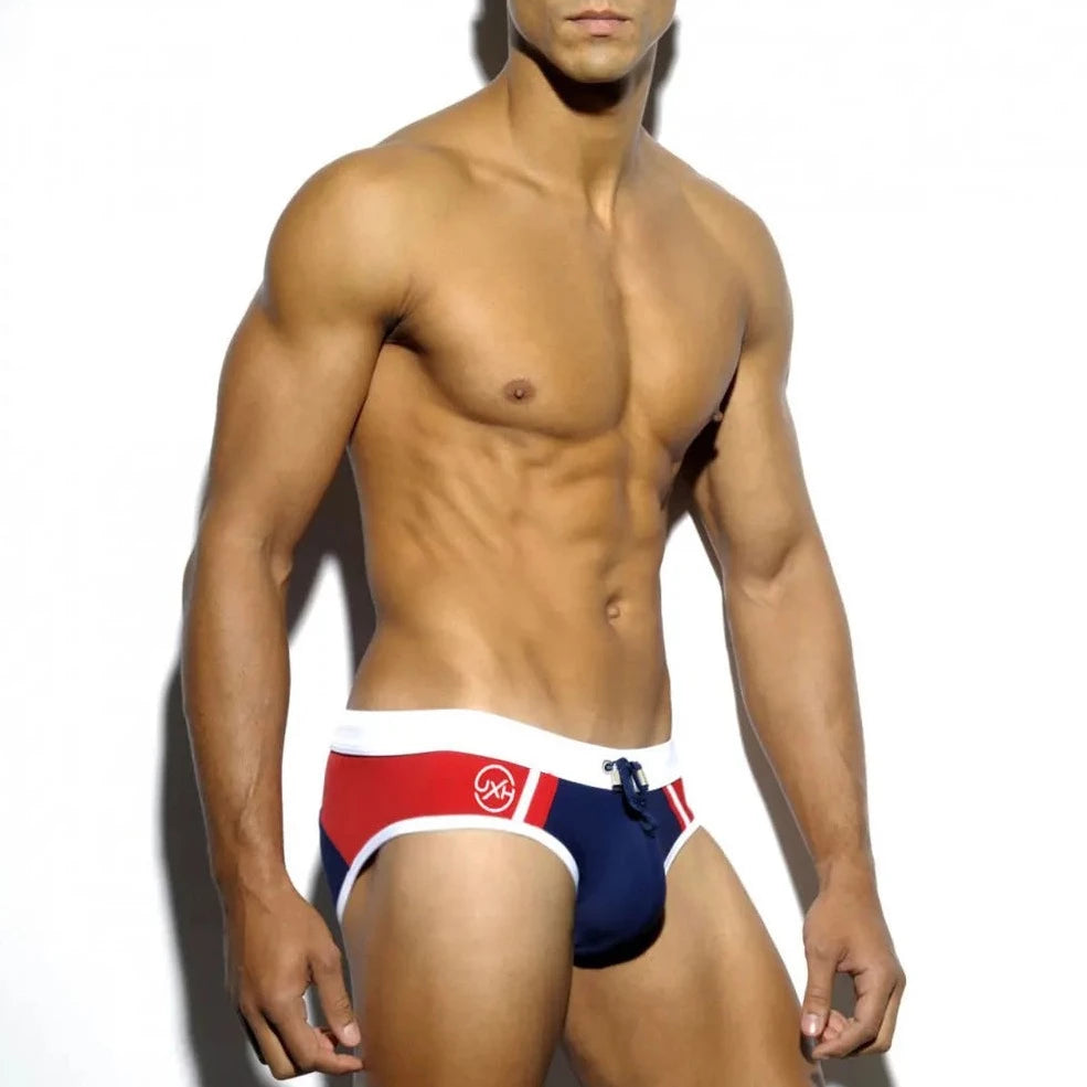 a hot gay man in dark blue Men's Two-toned Bold Swim Briefs - pridevoyageshop.com - gay men’s underwear and swimwear