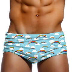 a hot gay man in Rainbow Stars Swim Trunks - pridevoyageshop.com - gay men’s underwear and swimwear