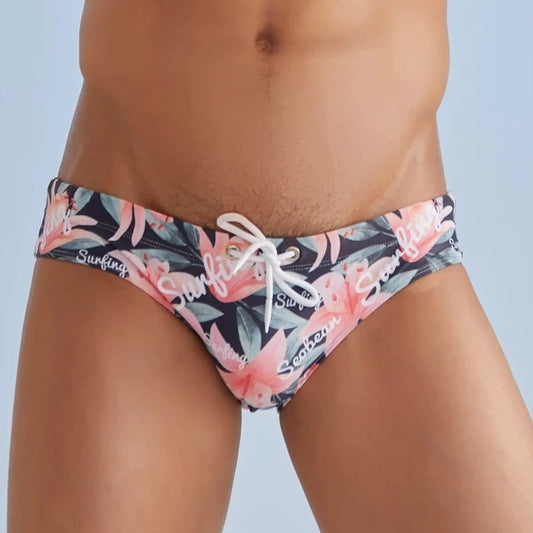 a hot gay man in dark blue Men's Floral Bikini Swim Briefs - pridevoyageshop.com - gay men’s underwear and swimwear