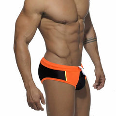 a sexy gay man in orange Men's Patchwork Bowtie Swim Briefs - pridevoyageshop.com - gay men’s underwear and swimwear