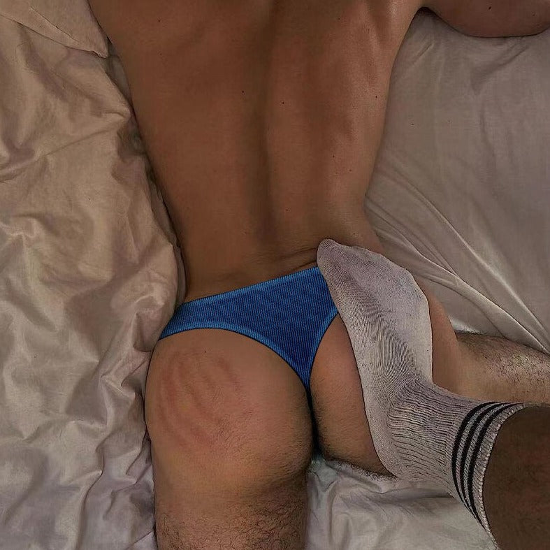 a man in blue ADANNU - Combed Cotton Gay Thongs: Sexy Male Underwear stepped on by a sexy male foot - pridevoyageshop.com - gay men’s underwear and swimwear