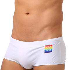 a hot gay in white Love Is Love Pride Swim Trunks - pridevoyageshop.com - gay men’s underwear and swimwear