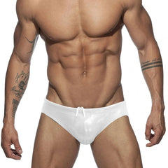 a hot gay man in silver Glide Metallic Swim Briefs - pridevoyageshop.com - gay men’s underwear and swimwear