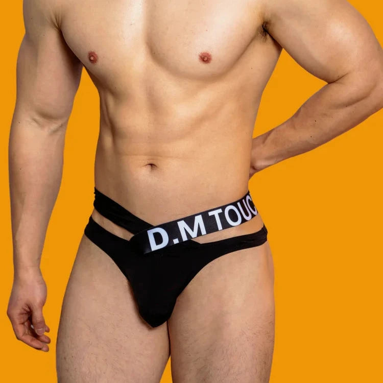 a hot man in black DM Touch Me Strap Thong - pridevoyageshop.com - gay men’s thongs, boxers, briefs and jockstraps