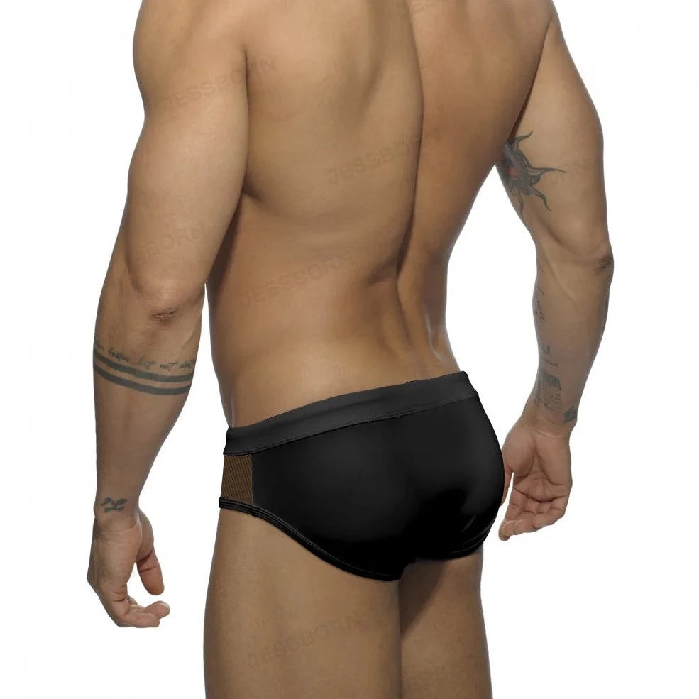 a sexy gay man in black Men's Sideshow Mesh Swim Briefs - pridevoyageshop.com - gay men’s underwear and swimwear