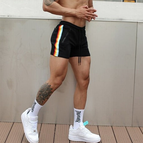 sexy gay man in black Rainbow Striped Gym Booty Shorts | Gay Shorts - Men's Activewear, gym short, sport shorts, running shorts- pridevoyageshop.com