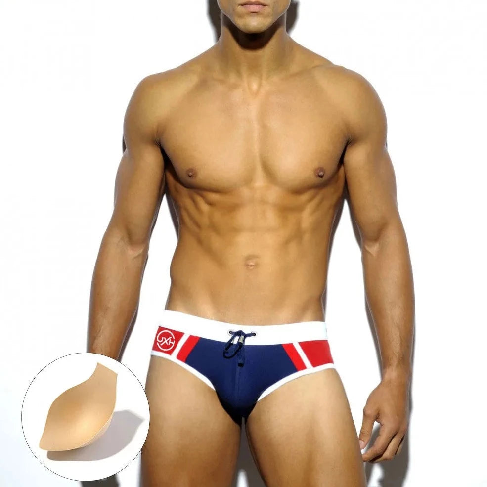a hot gay man in dark blue Men's Two-toned Bold Swim Briefs - pridevoyageshop.com - gay men’s underwear and swimwear