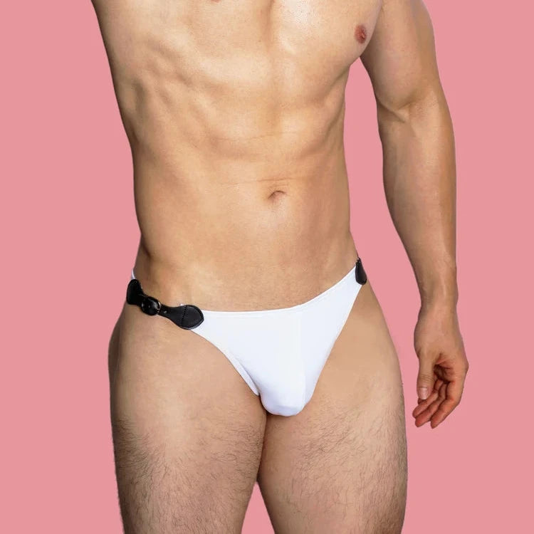 a sexy gay man in white VividFlash Leather Buckle Bikini Briefs - pridevoyageshop.com - gay men’s underwear and swimwear