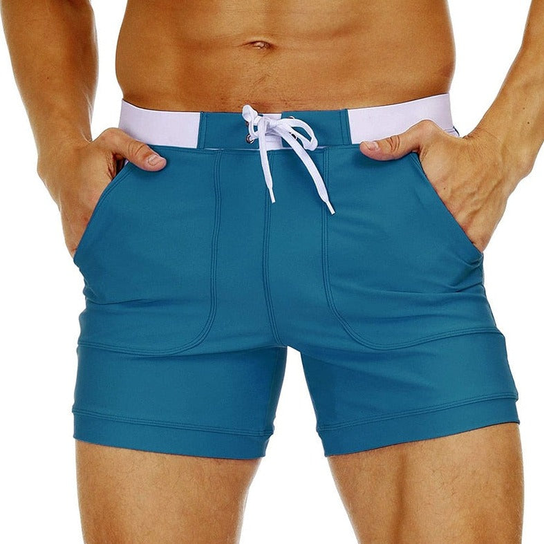 hot gay man in Peacock Blue Gay Swimwear & Beachwear | Drawstring Boxer Swim Trunks - pridevoyageshop.com - gay men’s underwear and swimwear