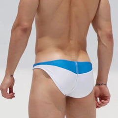a sexy gay man in white DESMIIT Men's D-Surf Swim Briefs - pridevoyageshop.com - gay men’s underwear and swimwear