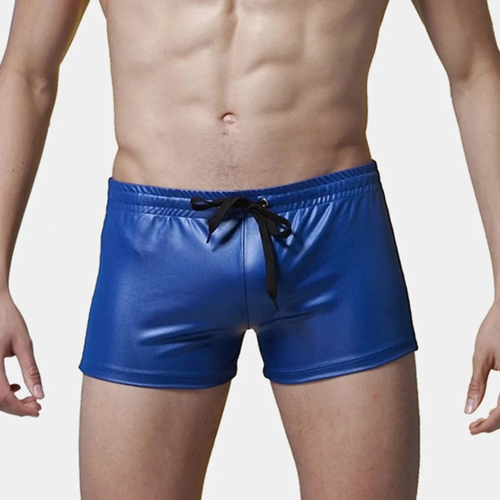 a sexy gay man in blue Solid Color Faux Leather Swim Trunks - pridevoyageshop.com - gay men’s underwear and swimwear
