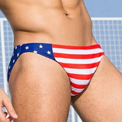 a hot gay man in US National Flags Skinny Swim Briefs - pridevoyageshop.com - gay men’s underwear and swimwear