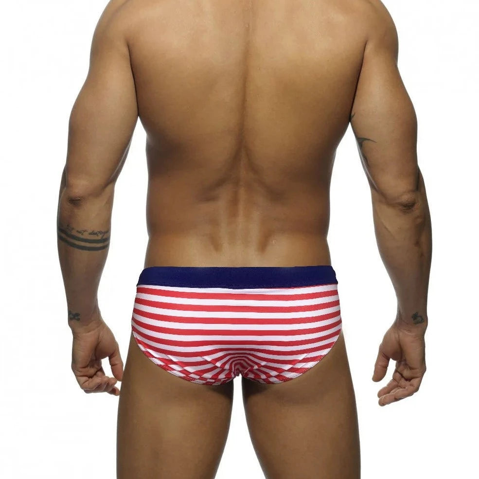 a hot gay man in red Sailor‘s Striped Bowtie Swim Briefs - pridevoyageshop.com - gay men’s underwear and swimwear
