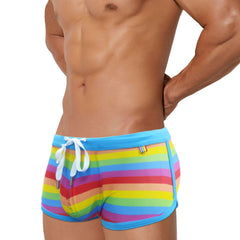 hot gay man in Gay Swimwear | Gay Men's Rainbow Drawstring Swim Trunks - pridevoyageshop.com - gay men’s underwear and swimwear