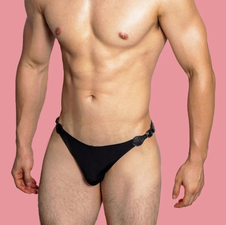 a sexy gay man in black VividFlash Leather Buckle Bikini Briefs - pridevoyageshop.com - gay men’s underwear and swimwear