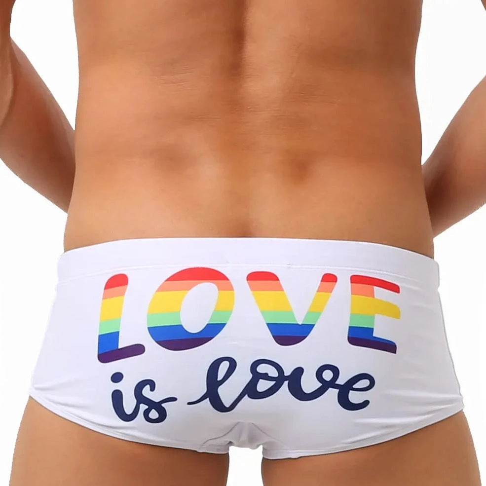 a hot gay in white Love Is Love Pride Swim Trunks - pridevoyageshop.com - gay men’s underwear and swimwear