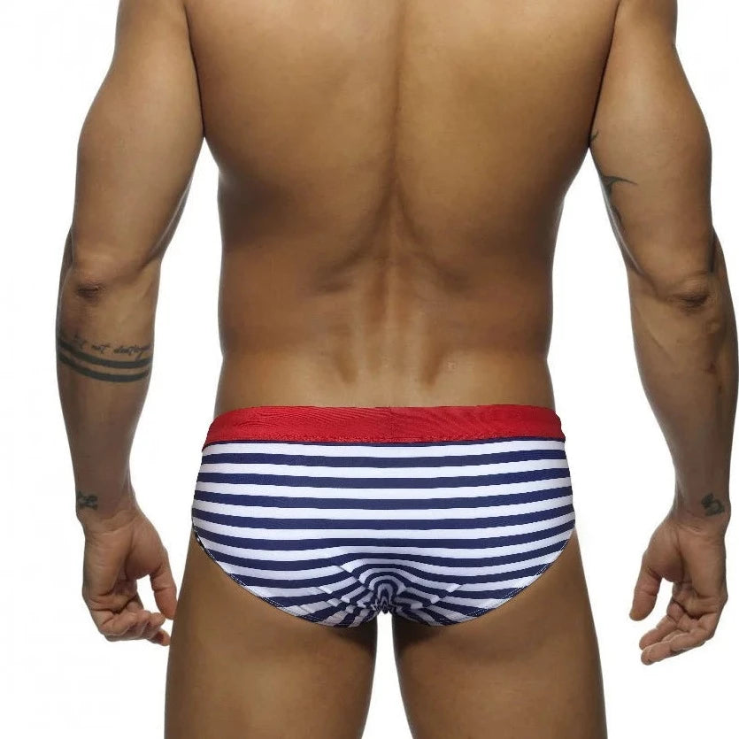a hot gay man in blue Sailor‘s Striped Bowtie Swim Briefs - pridevoyageshop.com - gay men’s underwear and swimwear