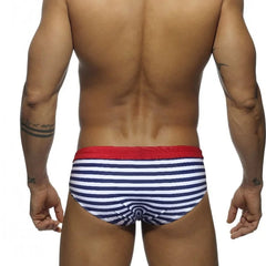 a hot gay man in blue Sailor‘s Striped Bowtie Swim Briefs - pridevoyageshop.com - gay men’s underwear and swimwear