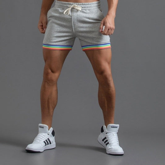 sexy gay man in light gray Men's Rainbow Gym Shorts with Pockets | Gay Shorts - Men's Activewear, gym short, sport shorts, running shorts- pridevoyageshop.com
