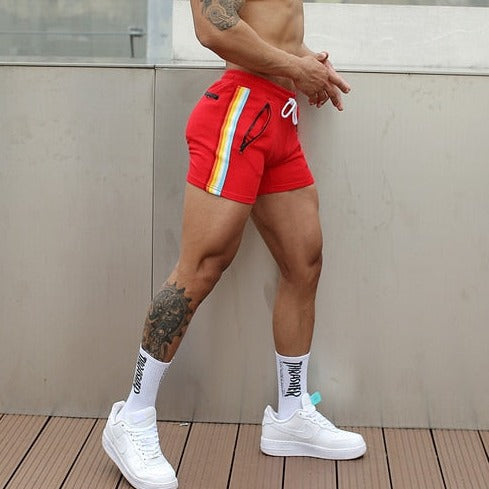 sexy gay man in red Rainbow Striped Gym Booty Shorts | Gay Shorts - Men's Activewear, gym short, sport shorts, running shorts- pridevoyageshop.com