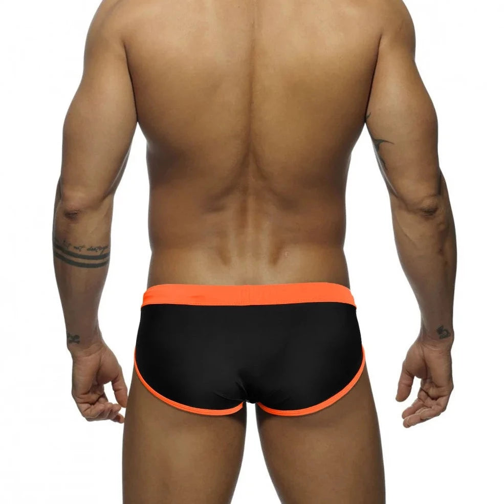 a sexy gay man in orange Men's Patchwork Bowtie Swim Briefs - pridevoyageshop.com - gay men’s underwear and swimwear
