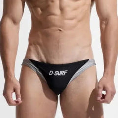 a sexy gay man in black DESMIIT Men's D-Surf Swim Briefs - pridevoyageshop.com - gay men’s underwear and swimwear