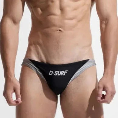 a sexy gay man in black DESMIIT Men's D-Surf Swim Briefs - pridevoyageshop.com - gay men’s underwear and swimwear