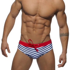 a hot gay man in blue Sailor‘s Striped Bowtie Swim Briefs - pridevoyageshop.com - gay men’s underwear and swimwear